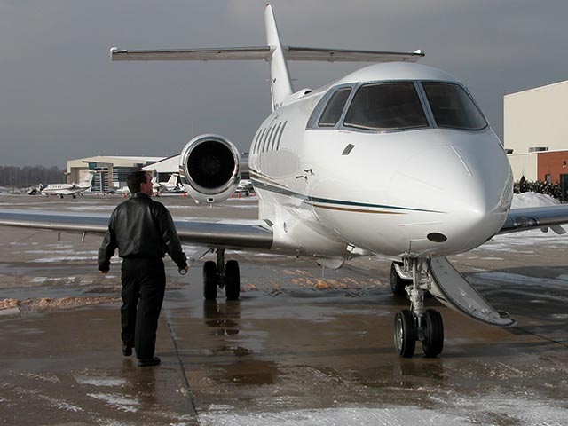 Pilot inspecting aircraft