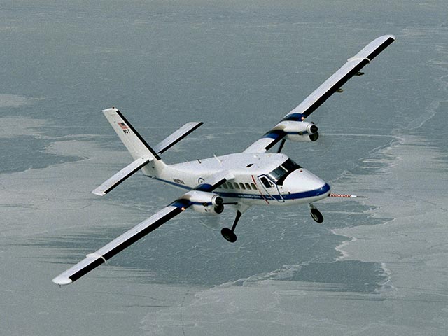 Twin Otter aircraft climbing