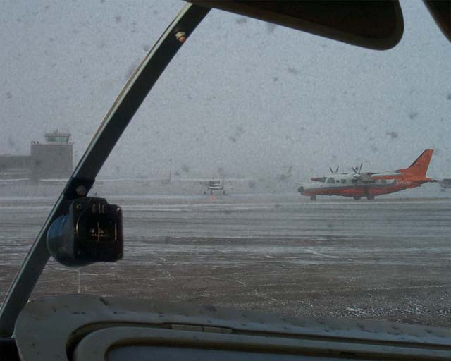 Cockpit view of runway in snow