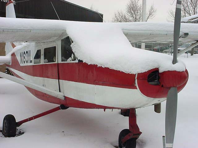 Snow covering parked aircraft