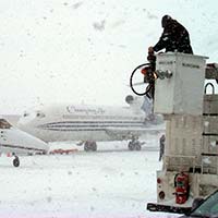 Parked aircraft with frost and snow