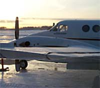 Aircraft with frost on tarmac