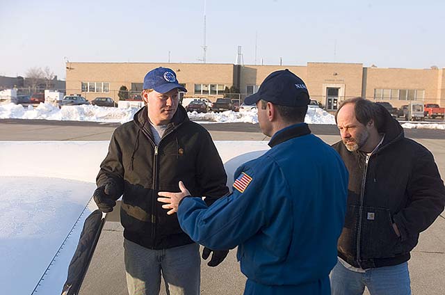 Pilot communicating with ground crew